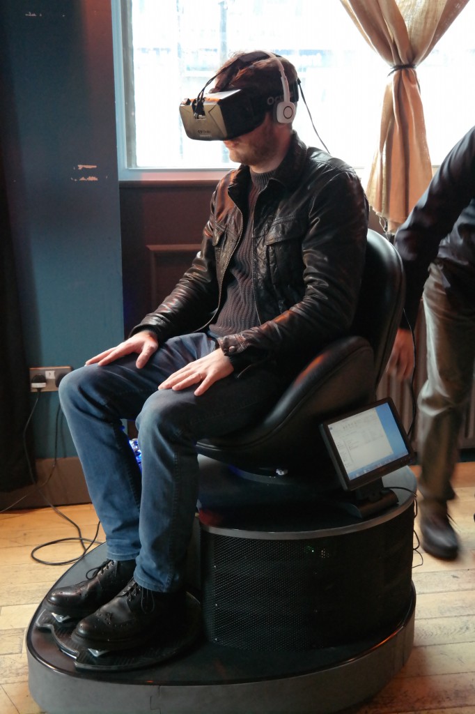 Another journalist sits atop the prototype version of Roto
