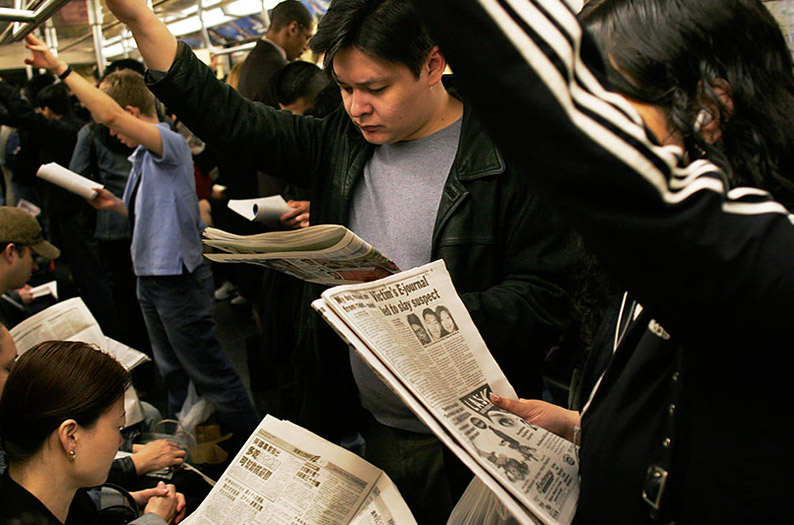 NYC_subway_riders_with_their_newspapers